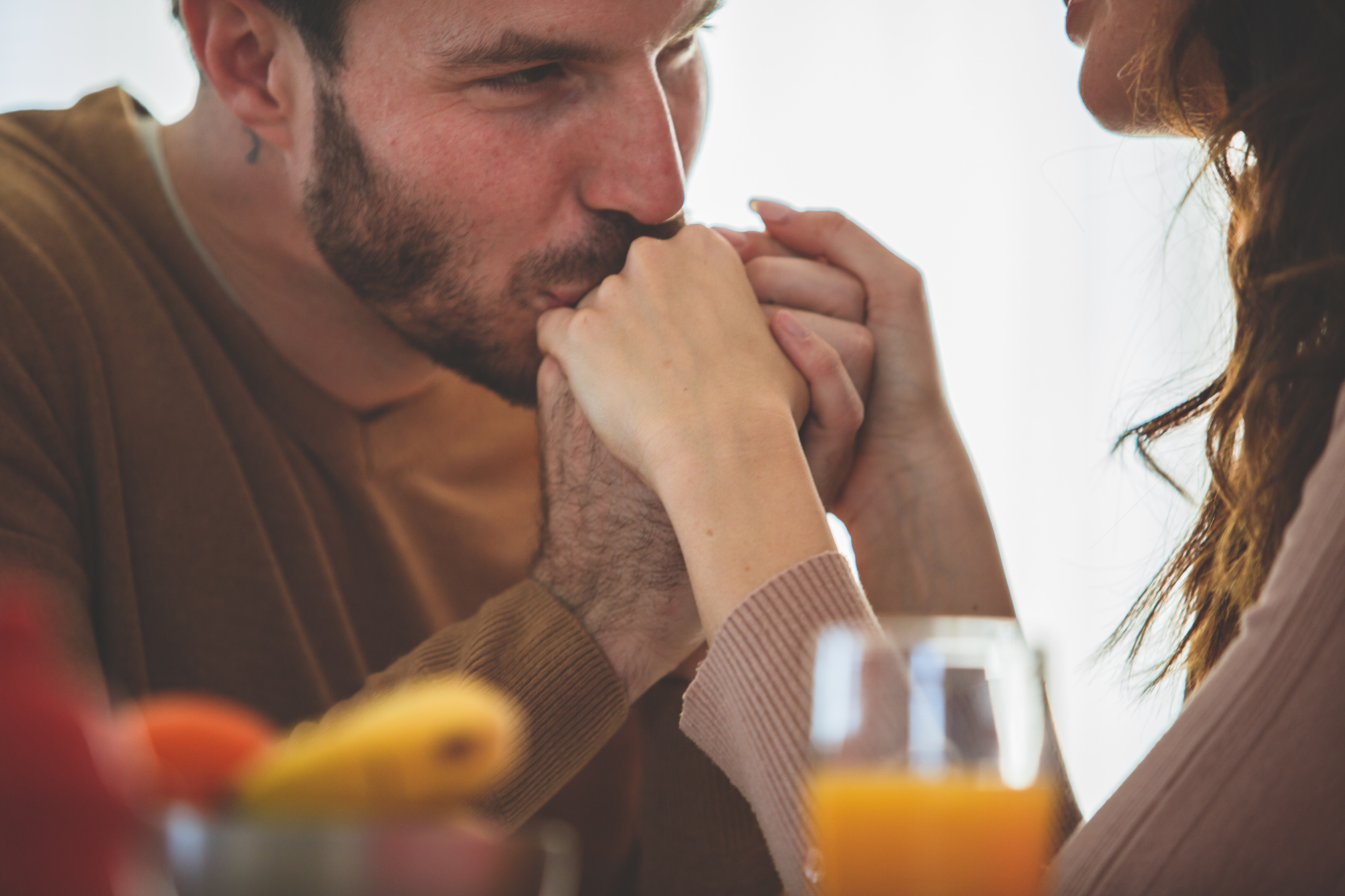 Man kisses woman's hand